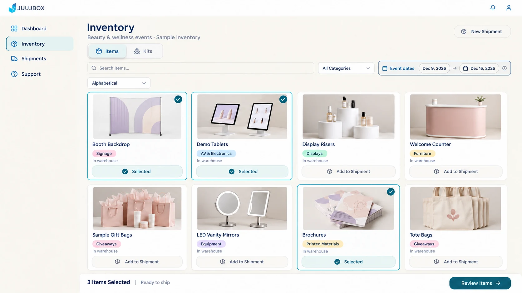 Juujbox customer portal sample inventory showing a booth backdrop, demo tablets, and brochures selected for shipment