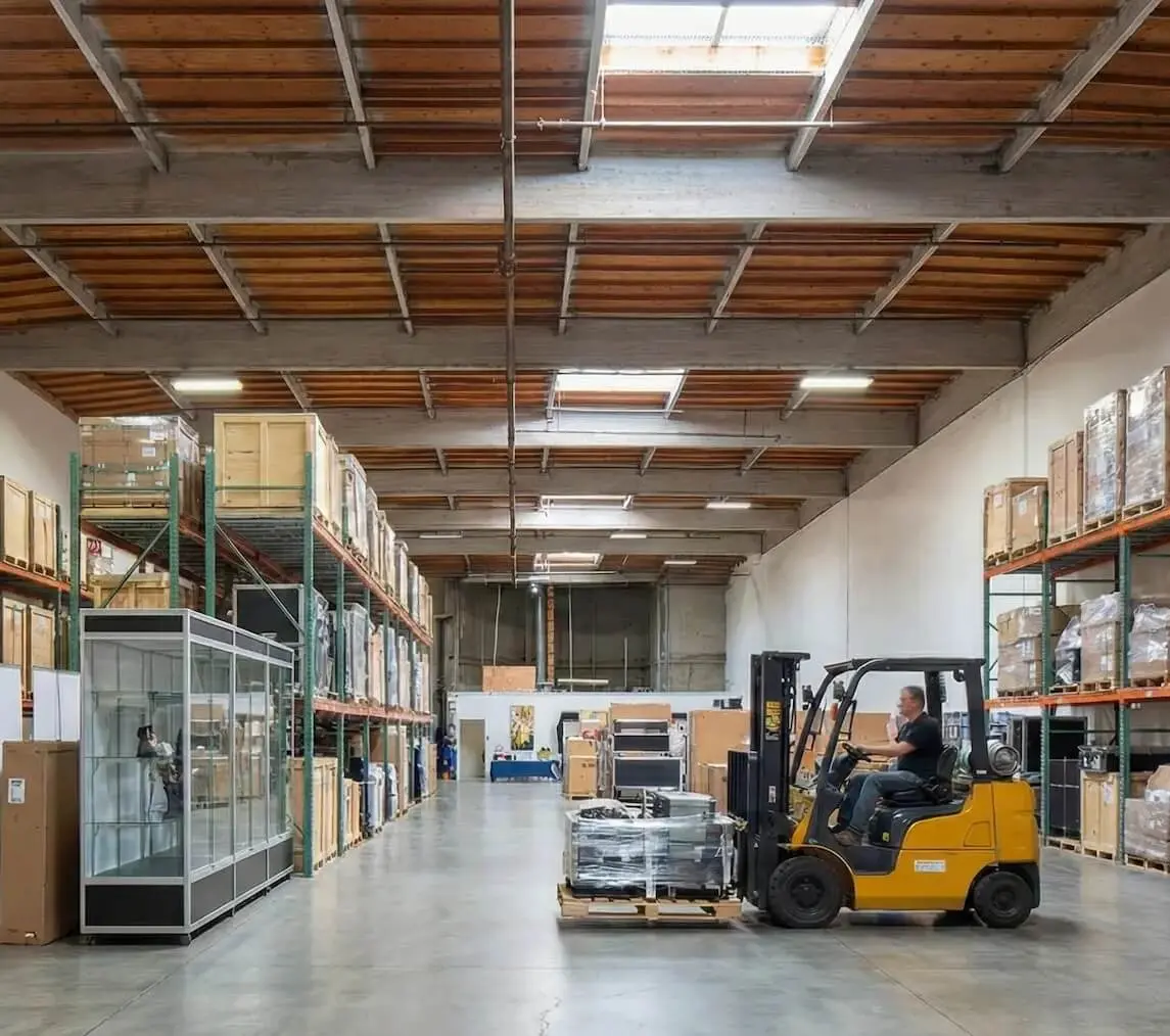 Forklift moving trade show freight at a San Diego advance warehouse