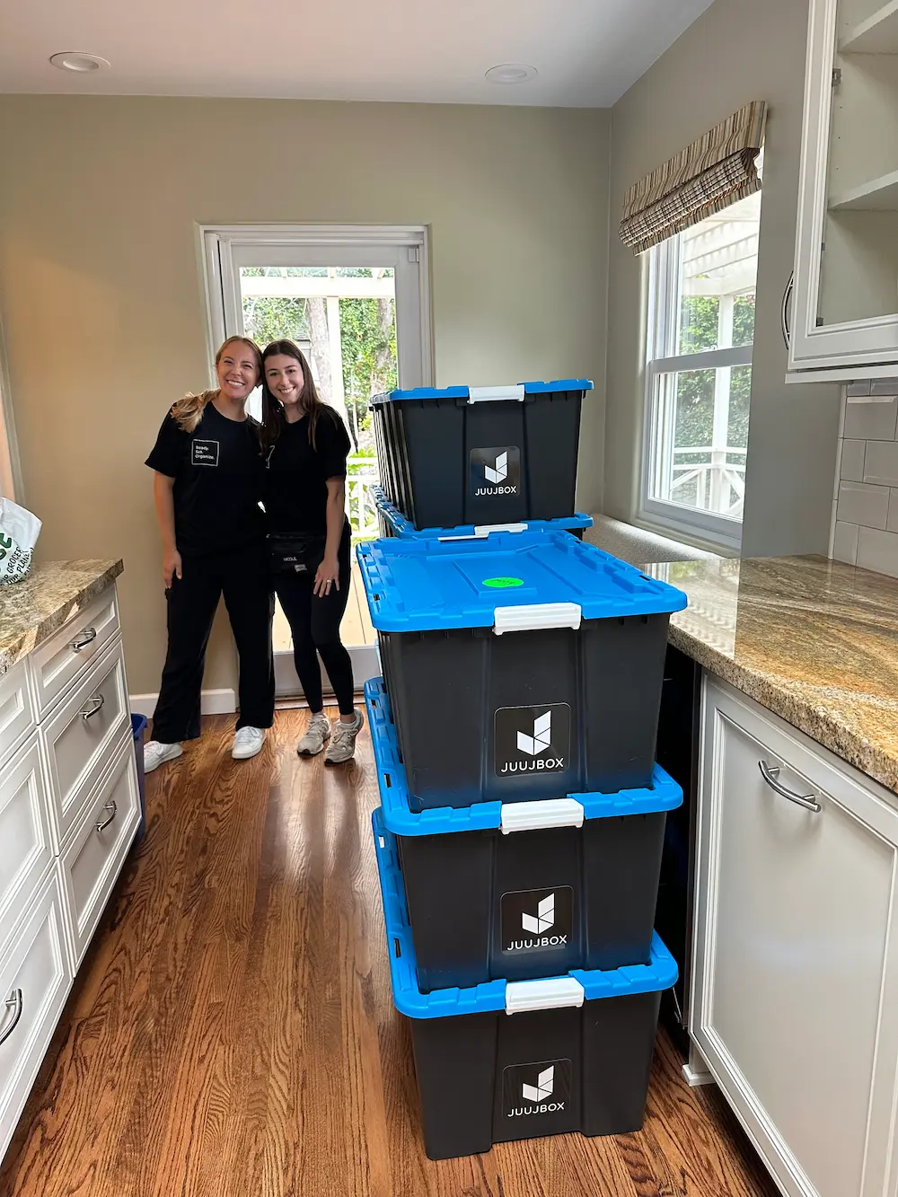 Professional organizers using Juujbox reusable moving bins in San Diego